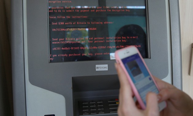 FILE PHOTO: A message demanding money is seen on a monitor of a payment terminal at a branch of Ukraine's state-owned bank Oschadbank after Ukrainian institutions were hit by a wave of cyber attacks earlier in the day, in Kiev, Ukraine, June 27, 2017.
Va