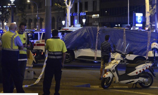 The van that ploughed into the crowd, killing 13 people and injuring around 100 others, is towed away from La Rambla in Barcelona AFP/Getty Images