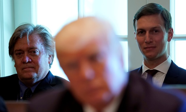 Trump advisers Steve Bannon (L) and Jared Kushner (R) listen as U.S. President Donald Trump meets with members of his Cabinet at the White House in Washington, U.S., June 12, 2017. REUTERS/Kevin Lamarque/File Photo