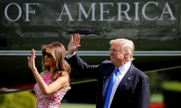 Donald and Melania Trump wave as they leave the White House, July 25, 2017. PHOTO: REUTERS
