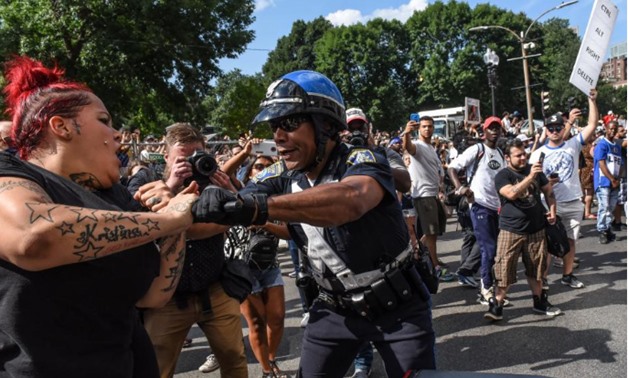 Counter protesters clash with Boston Police outside of the Boston Commons and the Boston Free Speech Rally in Boston, Massachusetts, U.S. - Reuters