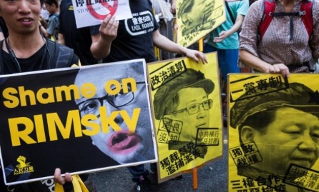The three activists were handed jail sentences for their role in 2014's massive Umbrella Movement protests, which called for fully free leadership elections and were an unprecedented challenge to Beijing