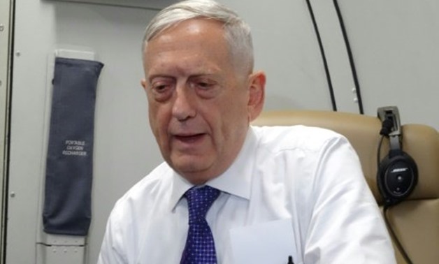 US Defense Secretary James Mattis speaks to reporters on board a flight to Jordan for the start of a regional tour - AFP