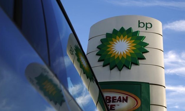 A BP logo is reflected in a car window at a petrol station in London- Luke MacGregor- Reuters