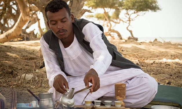 A man making the desert coffee (Al gabana) in Halayeb and Shalateen by Ali Dora