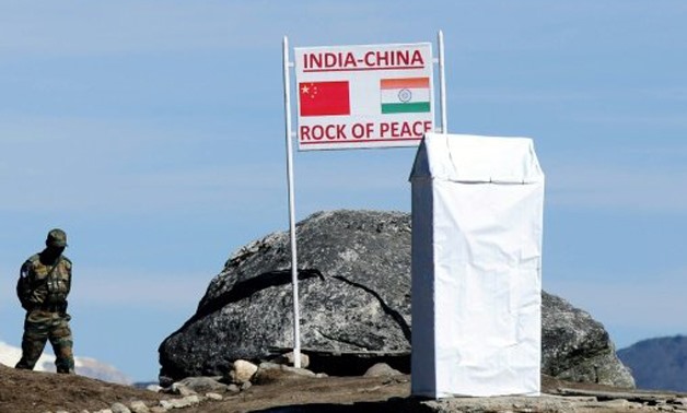 AFP/File | An Indian soldier keeping watch at Bumla Pass on the India-China border in Arunachal Pradesh