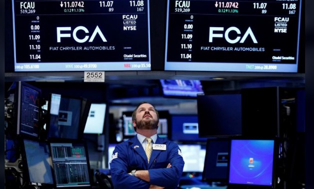 A specialist trader works at the post where Fiat Chrysler Automobiles is traded on the floor of the New York Stock Exchange (NYSE) in New York
