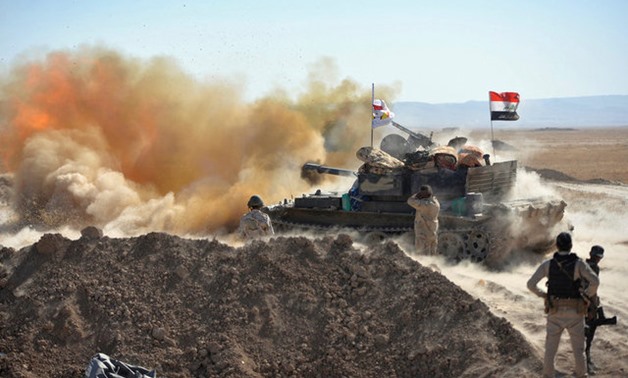 Iraqi army fire against Islamic State militants on the outskirts of Tal Afar - REUTERS