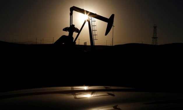 A pump jack is seen at sunrise near Bakersfield, California October 14, 2014.
Lucy Nicholson/File Photo