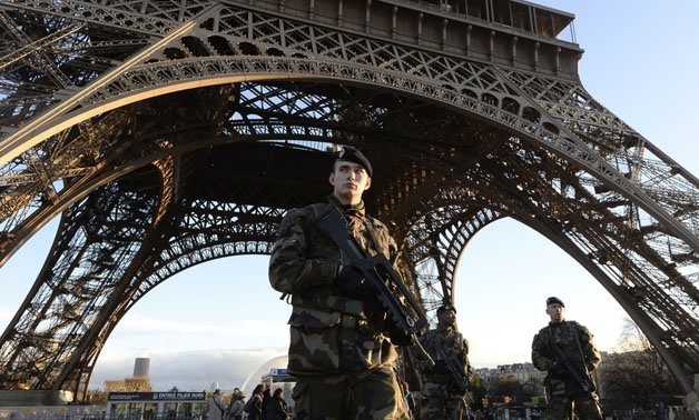 French soldiers patrol in front of the Eiffel Tower (Source: Bertrand Guay/AFP)
