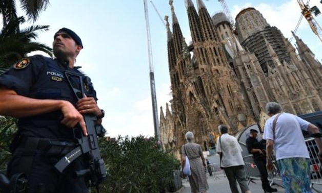 A police officer stands by the Sagrada Familia basilica in Barcelona-AFP