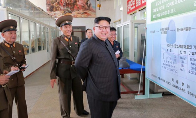 North Korean leader Kim Jong-Un smiles during a visit to the Chemical Material Institute of the Academy of Defense Science in this undated photo released by North Korea's Korean Central News Agency (KCNA) in Pyongyang on August 23, 2017. KCNA/via REUTERS