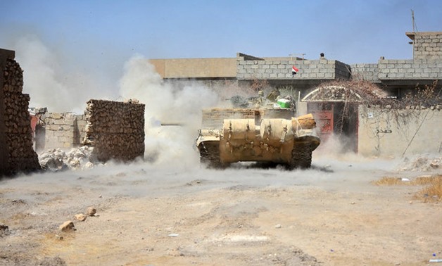 A tank of Iraqi army fires against Islamic State militants at Al Jazeera neighbourhood of Tal Afar - REUTERS