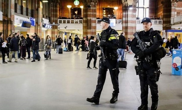 Dutch officers carry out extra patrols at the Central Station in Amsterdam, The Netherlands - REUTERS