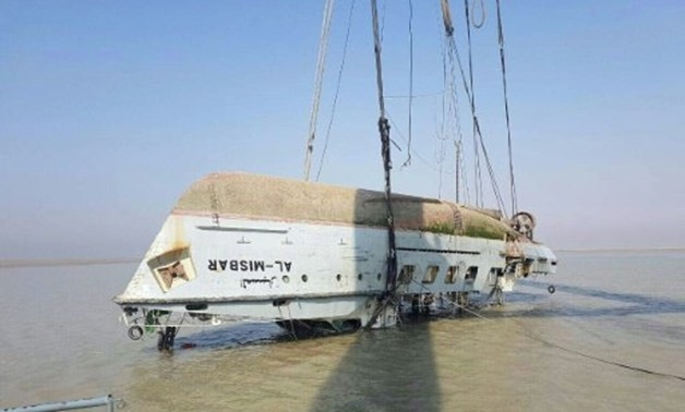 A handout picture released on August 24, 2017 by the Iraqi transport ministry shows the raised hull of the Al-Misbar, an Iraqi ship which sank off the country's southern coast in local waters after it collided with a foreign-flagged vessel  - AFP