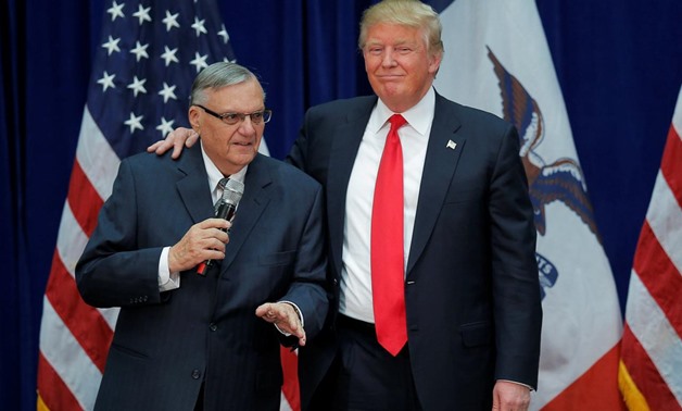 FILE PHOTO: U.S. Republican presidential candidate Donald Trump is joined onstage by Maricopa County Sheriff Joe Arpaio (L) at a campaign rally in Marshalltown, Iowa January 26, 2016, after Arpaio endorsed Trump's cacndidacy.
Brian Snyder/File Photo