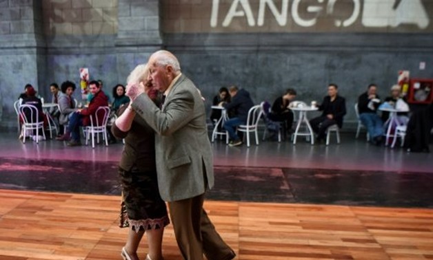 © AFP / by Sonia AVALOS | Tango dancers Nina Chudoba, 82, and Oscar Brusco, 90, dance in Buenos Aires -- they say their version of the classic dance is "floor tango -- none of this twirling of the legs"