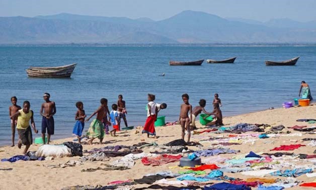 Life is focused around Lake Malawi: bathing, washing, playing, fishing… everything is done there- Madnomad Blog