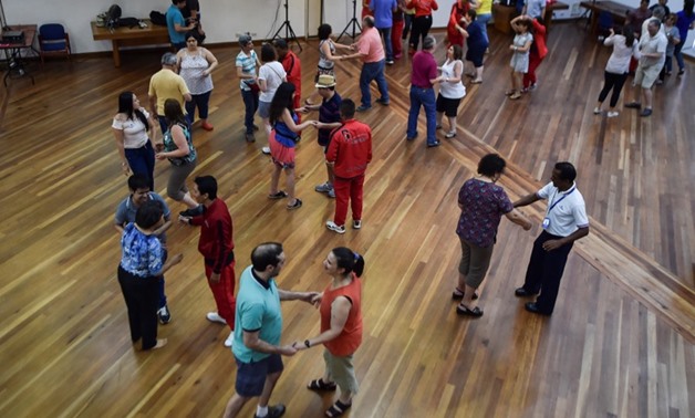 Visually impaired people attend a salsa dance class in Cali, Colombia, on August 13, 2017, during the eighth version of the Tifloencuentro. — AFP pic