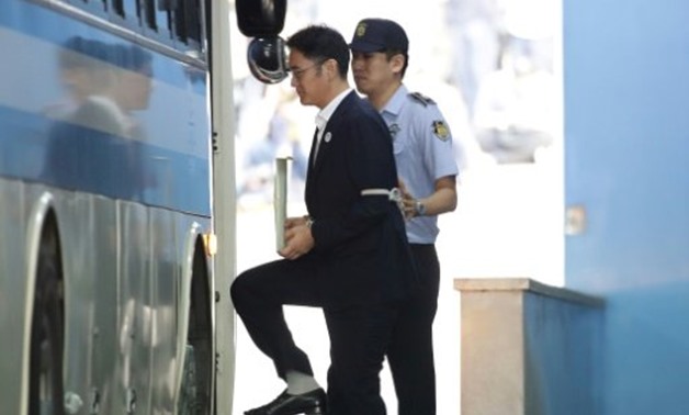 © POOL/AFP | Samsung Group heir Lee Jae-yong leaves the Seoul Central District Court following his conviction for bribing South Korea's ousted president Park Geun-Hye