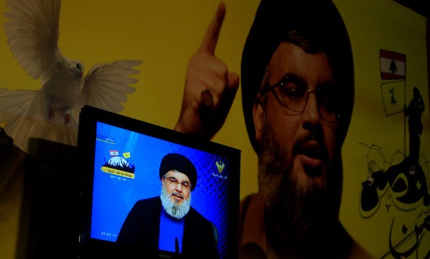 Lebanon's Hezbollah leader Sayyed Hassan Nasrallah is seen speaking on television in Nabatieh in southern Lebanon - REUTERS