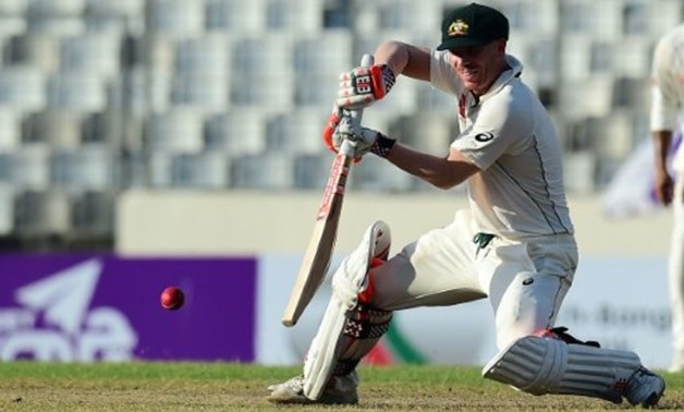  Australian batsman David Warner plays a shot during the third day of the first Test against Bangladesh at the Sher-e-Bangla National Cricket Stadium in Dhaka, on August 29, 2017