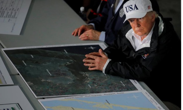 U.S. President Donald Trump receives a briefing on Tropical Storm Harvey relief efforts in Corpus Christi