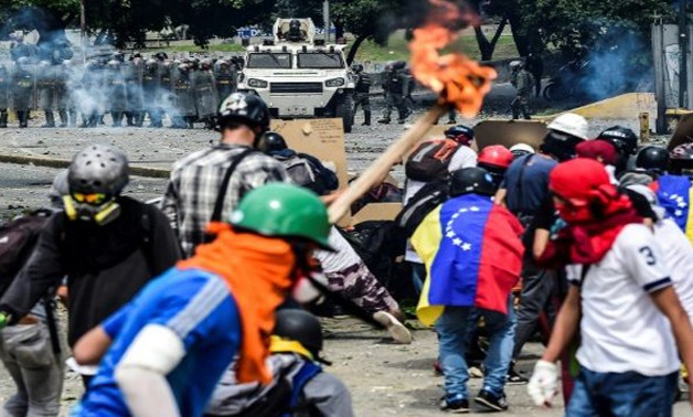  AFP/File / by Nina LARSON | Months of street demonstrations, as well as an economic crisis, have deepened unrest in Venezuela