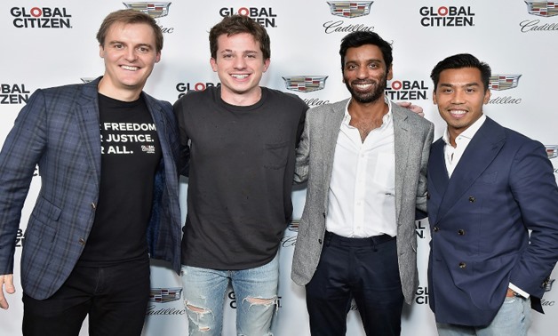 L-R) CEO of Global Citizen and Global Poverty Project Hugh Evans, musician Charlie Puth, CFO at Sanergy Sanj Sanampudi, and Cadillac Representative Nathan Tan