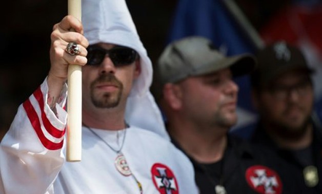  AFP/File | Supporters of the white supremacist Ku Klux Klan hold a rally in Charlottesville, Virginia on July 8, 2017