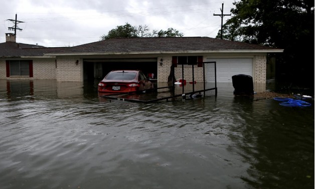 A house is seen submerged by flood waters from Tropical Storm Harvey in Orange