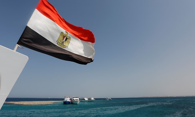 Egyptian Flag is hoisted on a mast of a sailing in the Red Sea