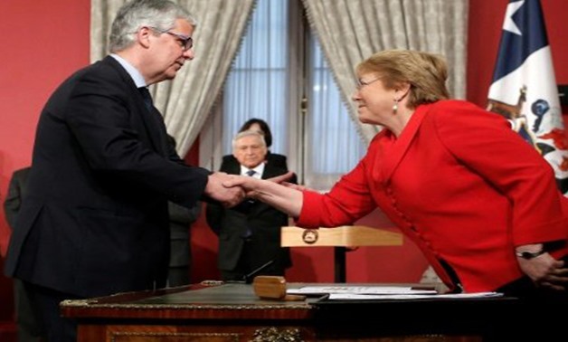 ATON Chile/AFP | Chilean President Michelle Bachelet (R) has appointed Nicolas Eyzaguirre (L) as her new finance minister
