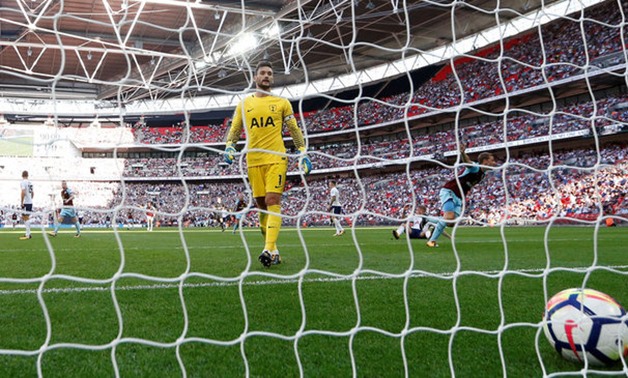 Tottenham's Hugo Lloris looks dejected as Burnley’s Chris Wood celebrates scoring their first goal Action Images via Reuters/Matthew Childs