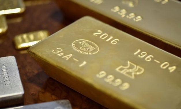Gold bars imprinted with the word Kazakhstan are seen at the country's National Bank vault in Almaty, Kazakhstan, September 30, 2016. REUTERS/Mariya Gordeyeva