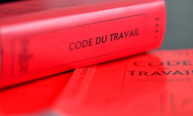 opies of French labour code are displayed on August 29, 2017 in Nantes, western France