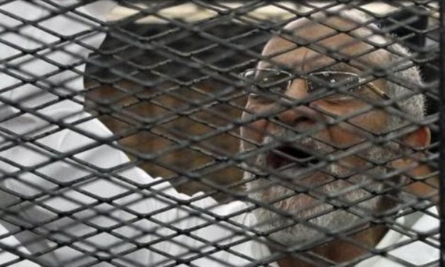 Muslim Brotherhood leader Mohammed Badie shouts slogans from the defendant’s cage during his trial with other leaders of the Brotherhood in a courtroom in Cairo December 11, 2013. Credit: Reuters/Stringer