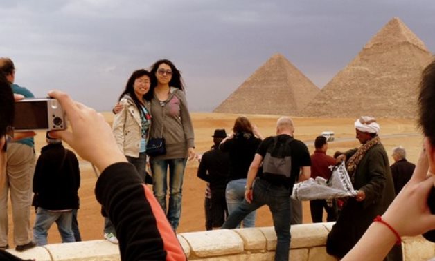 Japanese tourists in Giza Pyramids  - FILE 