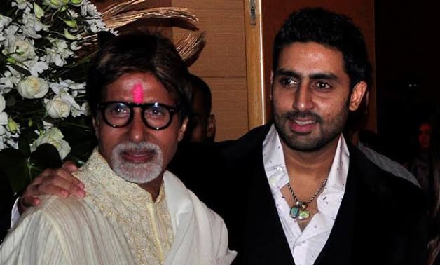 FILE PHOTO: Bollywood actors Amitabh Bachchan (L) and his son Abhishek Bachchan pose for a picture during a party of a new Bollywood production company in Mumbai February 28, 2010. REUTERS/Manav Manglani/