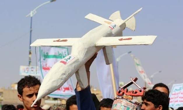 Followers of the Houthi movement carry a mock drone during a rally held to mark the Ashura in Saada. (File photo: Reuters)