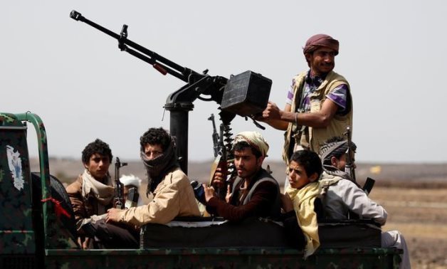 Houthi fighters ride on the back of a patrol truck as they secure the site of a pro-Houthi tribal gathering in a rural area near Sanaa, Yemen July 21, 2016. Reuters/Khaled Abdullah