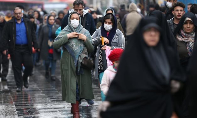 FILE PHOTO: Iranian women wear protective masks to prevent contracting a coronavirus, as they walk at Grand Bazaar in Tehran, Iran February 20, 2020. WANA (West Asia News Agency)/Nazanin Tabatabaee via REUTERS