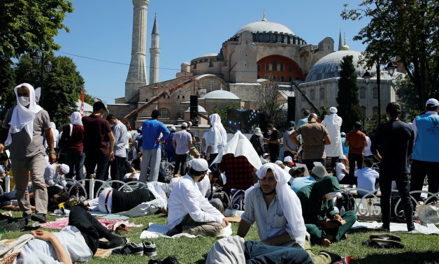 People wait for the beginning of Friday prayers outside Hagia Sophia Grand Mosque in Istanbul, Turkey, July 24, 2020. REUTERS/Umit Bektas