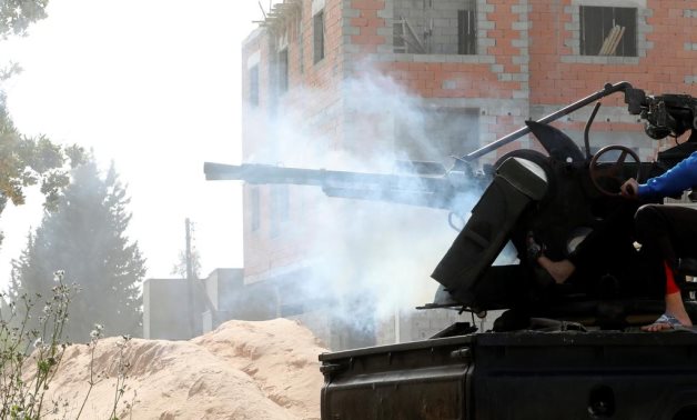 A member of the Libyan Government of National Accord (GNA) fires during a fight with Eastern forces in Ain Zara, Tripoli, Libya April 25, 2019. REUTERS/Hani Amara