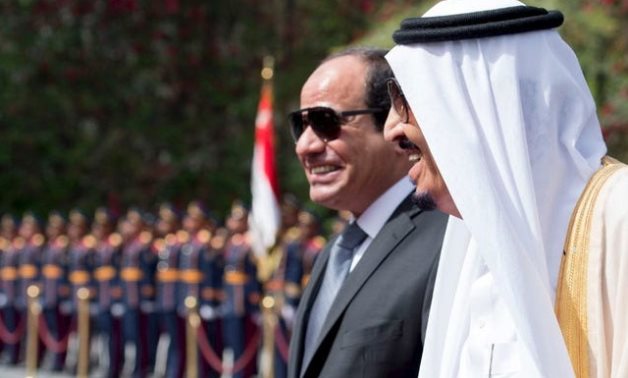 Egypt's President Abdel Fattah al-Sisi and Saudi Arabia's King Salman review the honour guards in Cairo - Thomson Reuters