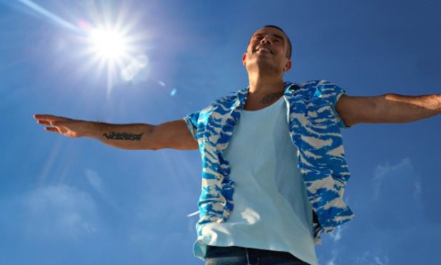 File: Amr Diab in a scene from '' Ya Baldna Ya Helwa''