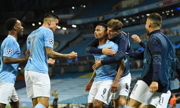 Man City players celebrate Jesus' goal, Reuters 
