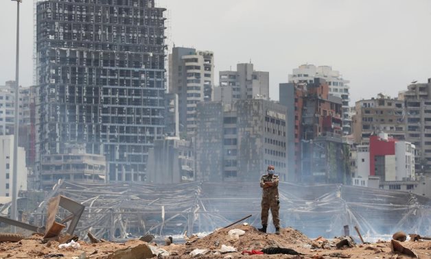 A soldier stands at the devastated site of the explosion at the port of Beirut, Lebanon August 6, 2020. Thibault Camus/Pool via REUTERS