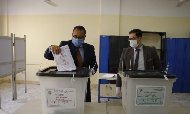Prime Minister Moustafa Madbouli on Tuesday cast his ballot in the Senate elections in the electoral committee of the Egyptian-Japanese school in Sheikh Zayed city.