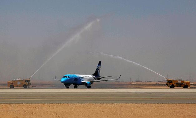 An EgyptAir plane arrives to a water cannon salute on the runway of the New Administrative Capital (NAC) Airport, July 9, 2019. Reuters